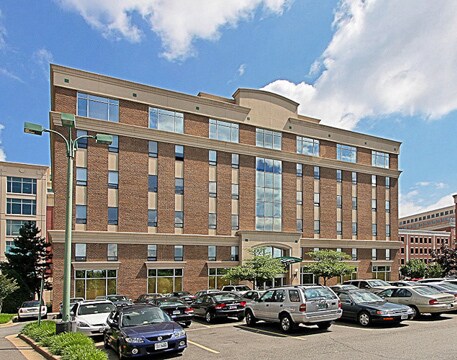 The brick office building at 2121 Eisenhower Avenue, Suite 301, Alexandria, Virginia